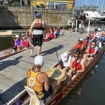 Coach-led discussion about technique while at the dock