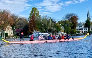 Team paddling in the Pink Boat during a Saturday open practice