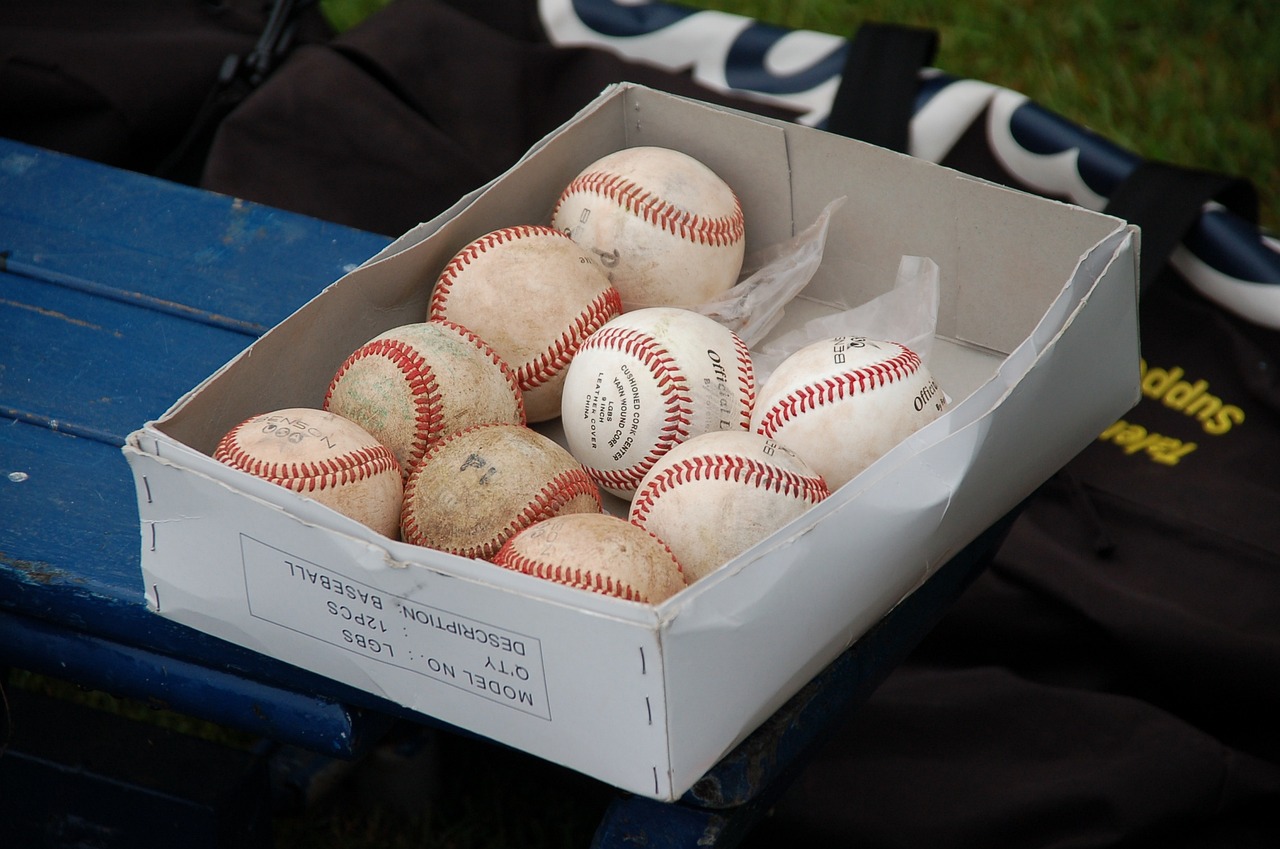 Box of baseballs on a bench