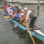 Coach Barbara steering the team during a paddle