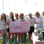 Bosom Buddies Charities presents the Annapolis Dragon Boat Club with a check for $5,000.