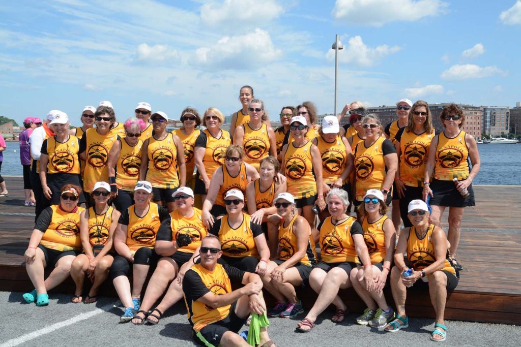 The Annapolis Dragon Boat Club celebrates after a 2019 race in Baltimore.